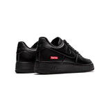 Nike Air Force 1 Low: Black Leather with Distinctive Red Supreme Details