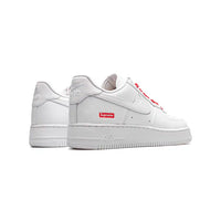 Nike Air Force 1 Low White Sneakers with Bold Supreme Red Accents